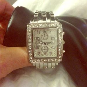 Sold..Stainless designer watch w/ rhinestone bezel