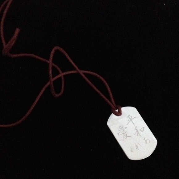 Chinese symbol pendant and string