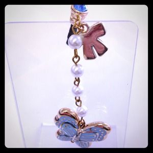 Cute blue butterfly with pretty pearls, bow, bling