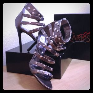 On hold. Carlos Santana gladiator style heels