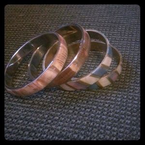 Bracelts. Very stylish :) will go with anything :)