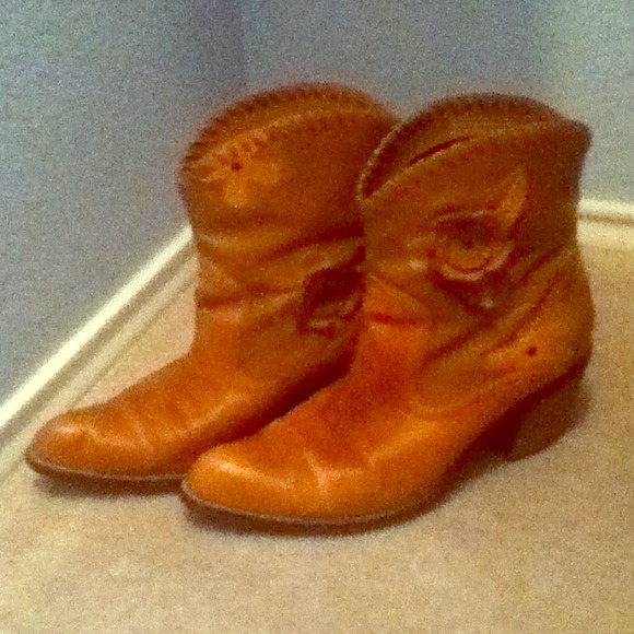 Brown cowgirl style booties with flower designs