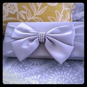 Silver Jessica McClintock clutch with bow