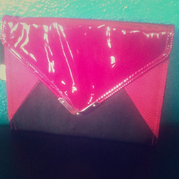 Hot pink and black Reaction hand clutch