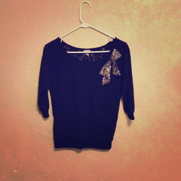 Black sweater with sequin bow