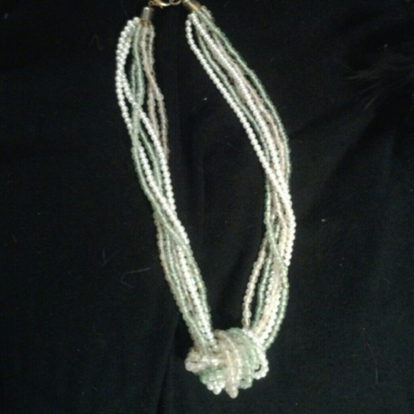 Strands of pink, light green and white necklace.