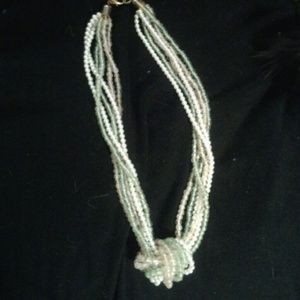 Strands of pink, light green and white necklace.