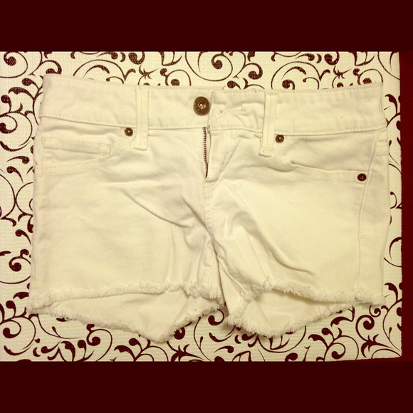 GUESS white jean shorts.