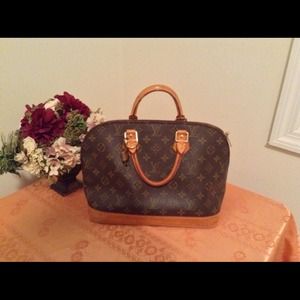 Sold..Authentic LV alma with lock, key and dustbag