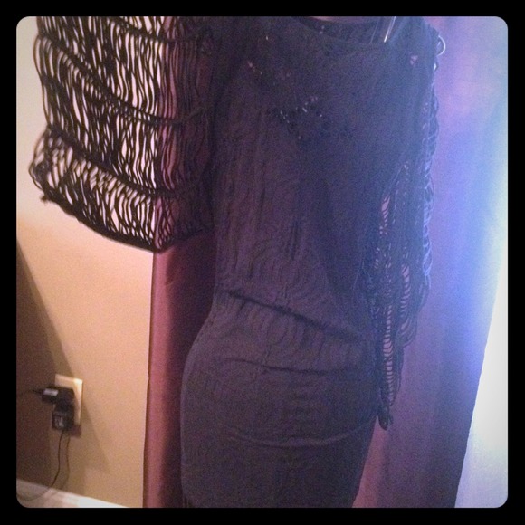 Mini black dress with lace type sleeves