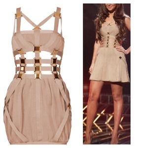 Cutout dress with gold metal designs.