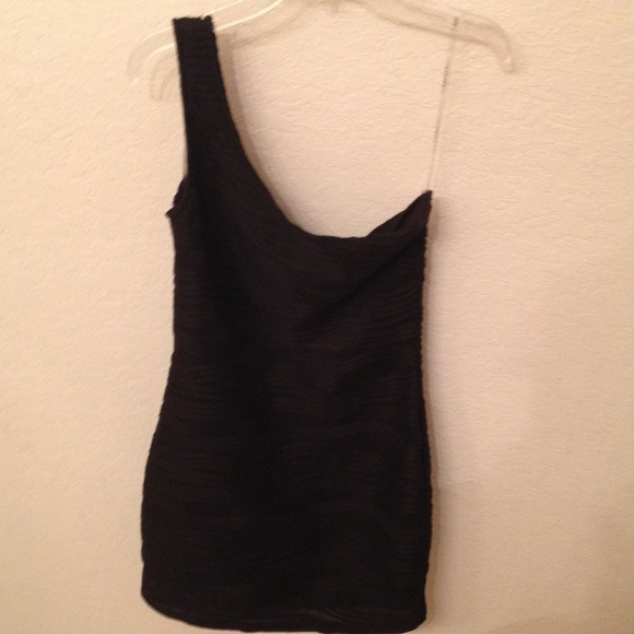 One shoulder black dress.