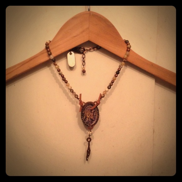 Beaded necklace w/Indian Chief coin like charm.