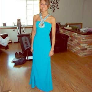 Bright aqua crystal low open back halter gown.