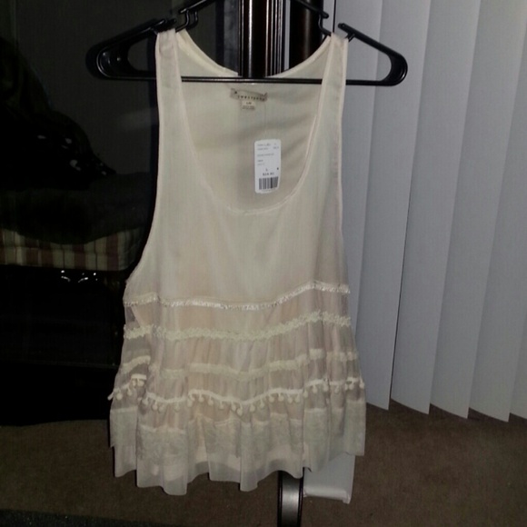 Cute off white top. Brand new; Never worn!
