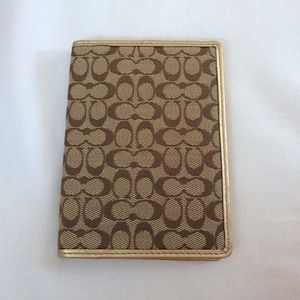 Coach gold passport holder