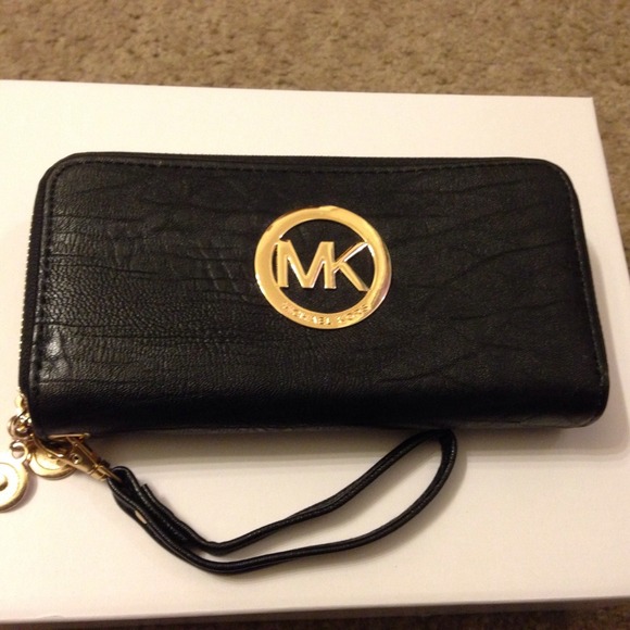 Brand new. MK rep wallet with strap.