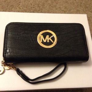 Brand new. MK rep wallet with strap.