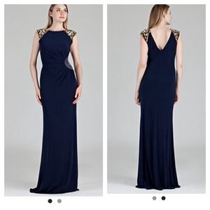 Ball gown, navy blue with embellished cap sleeves.
