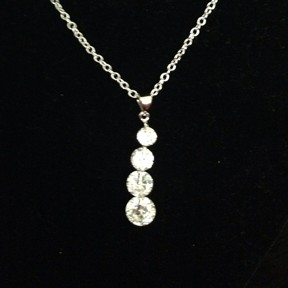 STERLING PENDANT AND CHAIN.. Simulated diamonds