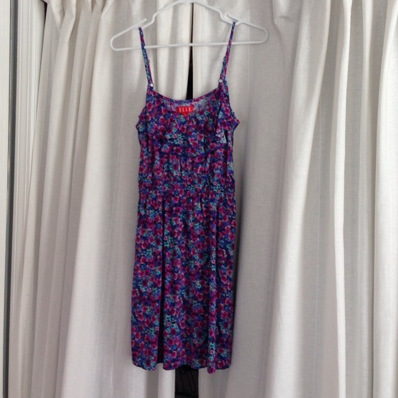 Floral pattern dress with long neckline ruffles.