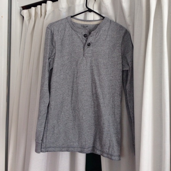 Grey long sleeve with double button up at top.