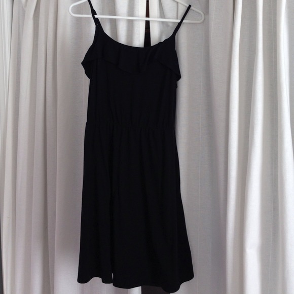 Spaghetti strap black dress with long ruffles.