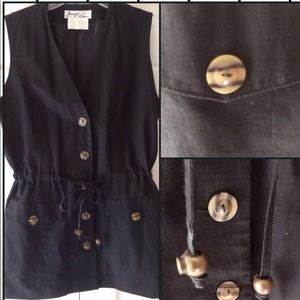 Black sleeveless jacket with drawstring. NWOT