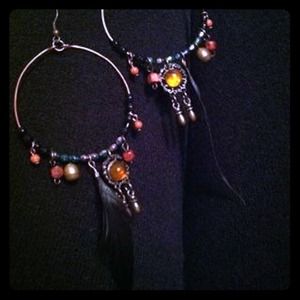 "SOLD" hoop earrings.