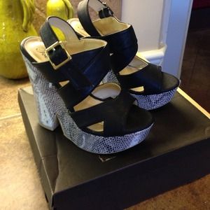 Black and snake skin wedges