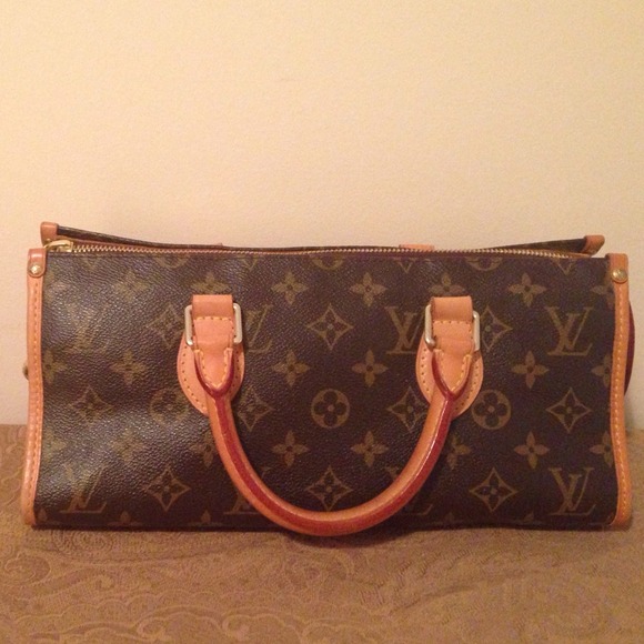 Louis Vuitton Triangle Sac Handbag in Monogram