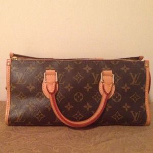 Louis Vuitton Triangle Sac Handbag in Monogram