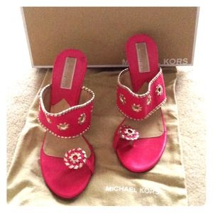 Michael Kors peony color stacked heel sandals.