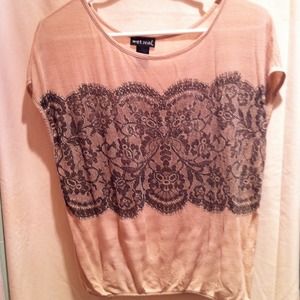 Tan top with black lace and sparkle detailing.