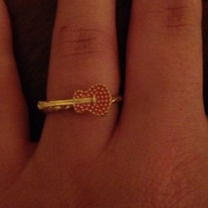 Gold and pink guitar ring