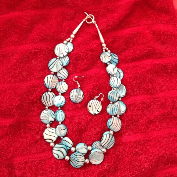 Sterling silver matching earring and necklace set.