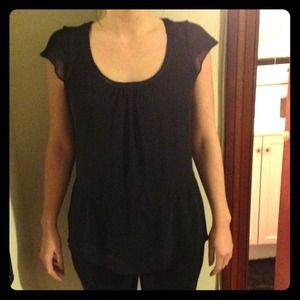 Loose fitting sheer black blouse