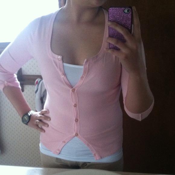 Soft pink button up cardigan.