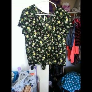 Somewhat of a crop top ties at the bottom