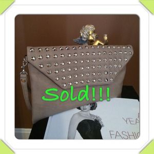 Brand new oversized clutch with tag