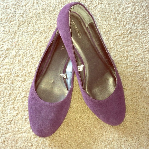 Purple suede kitten heel flats.