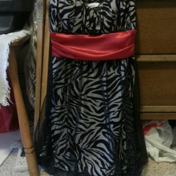 Black and silver with a red cover