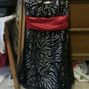 Black and silver with a red cover