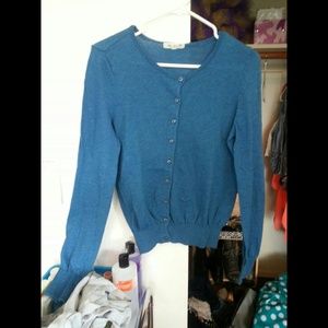 Blue cardigan fits more like a medium.