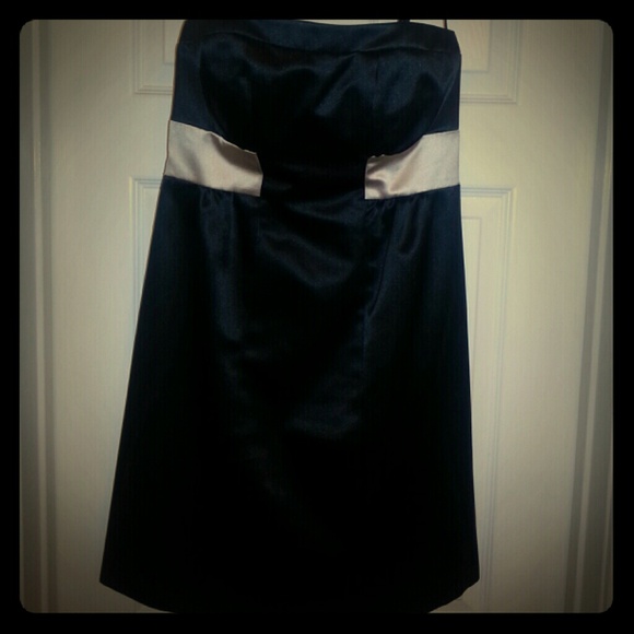 Black strapless dress with beige band around bust