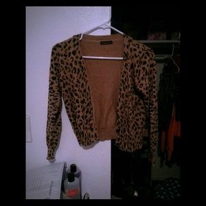 Cheetah cardigan fits small and medium.