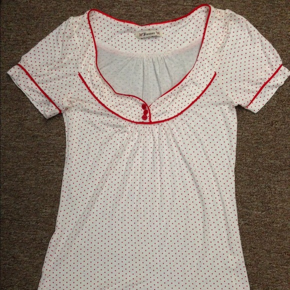 Red polka dot shirt.