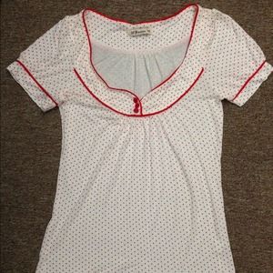 Red polka dot shirt.