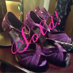 Sold!  Beautiful purple heels with great design.