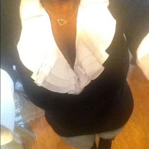 Ruffle collared shirt.